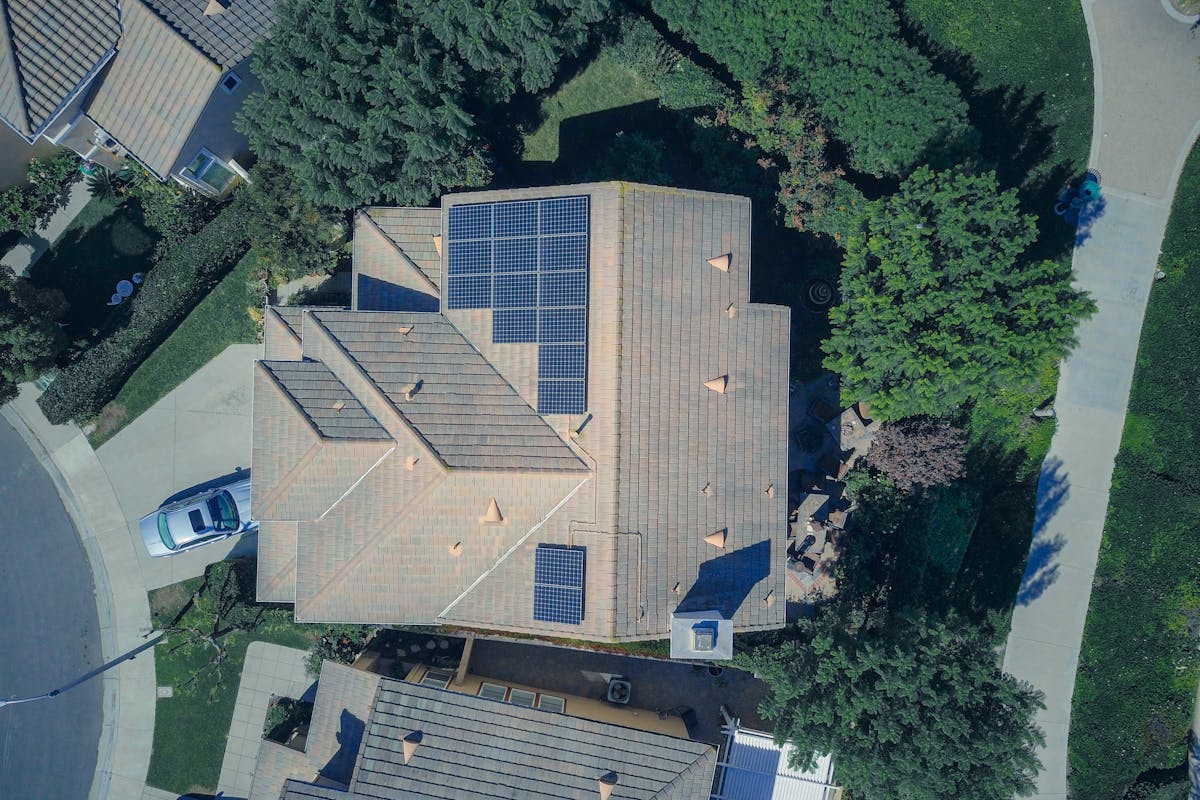 Rooftop solar panels on a modern home optimizing energy efficiency in sunny neighborhood